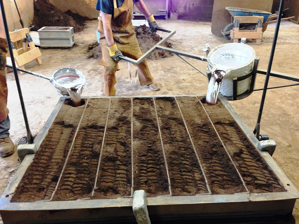 <strong> Liquid aluminum is poured into sand molds to create the marker plates. </strong> Courtesy Sewah Studios