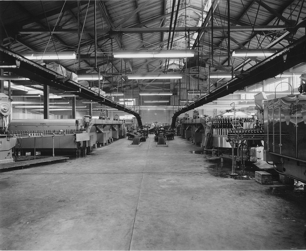 The upper level of the Bottling House, circa 1950, soon after operations began. Conveyors carried the filled cases from the second floor to the ground-floor loading docks.