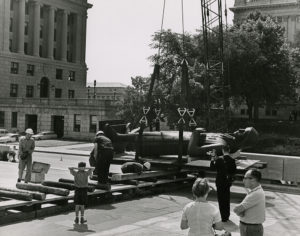 The Penn statue was rolled across the museum plaza on a series of logs to move it inside, June 1965.