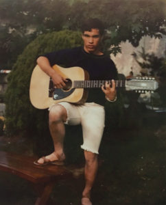 The high school wrestler with his acoustic guitar