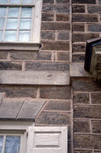 Cliveden was subjected to intense bombardment during the Battle of Germantown and bears the scars of cannonballs and gunfire, as seen in this photo on the house’s string course. Photo by John Boyd Henderson