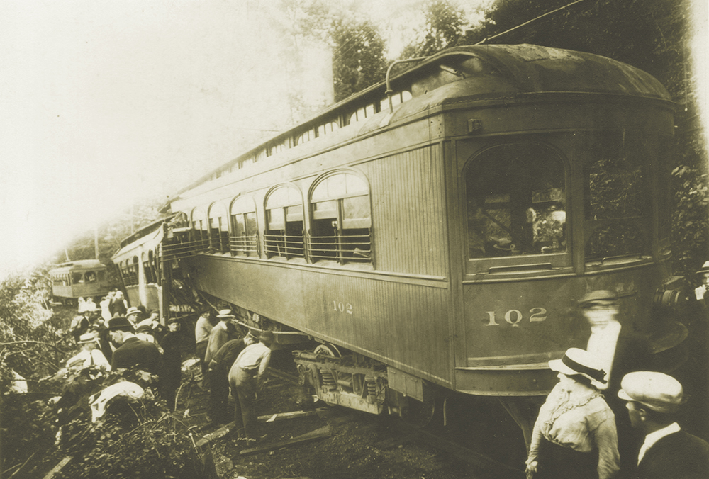 The tragic result is shown here. Car 104 has been split open and telescoped. Note that both vestibules where the motormen operated the cars are completely gone. Rob Quay Collection