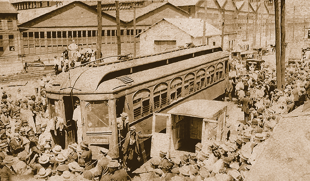 Unloading and transferring injured passengers from car 103 in Johnstown. The truck in the foreground is the only motorized vehicle in the photo. Harry Dishong Collection