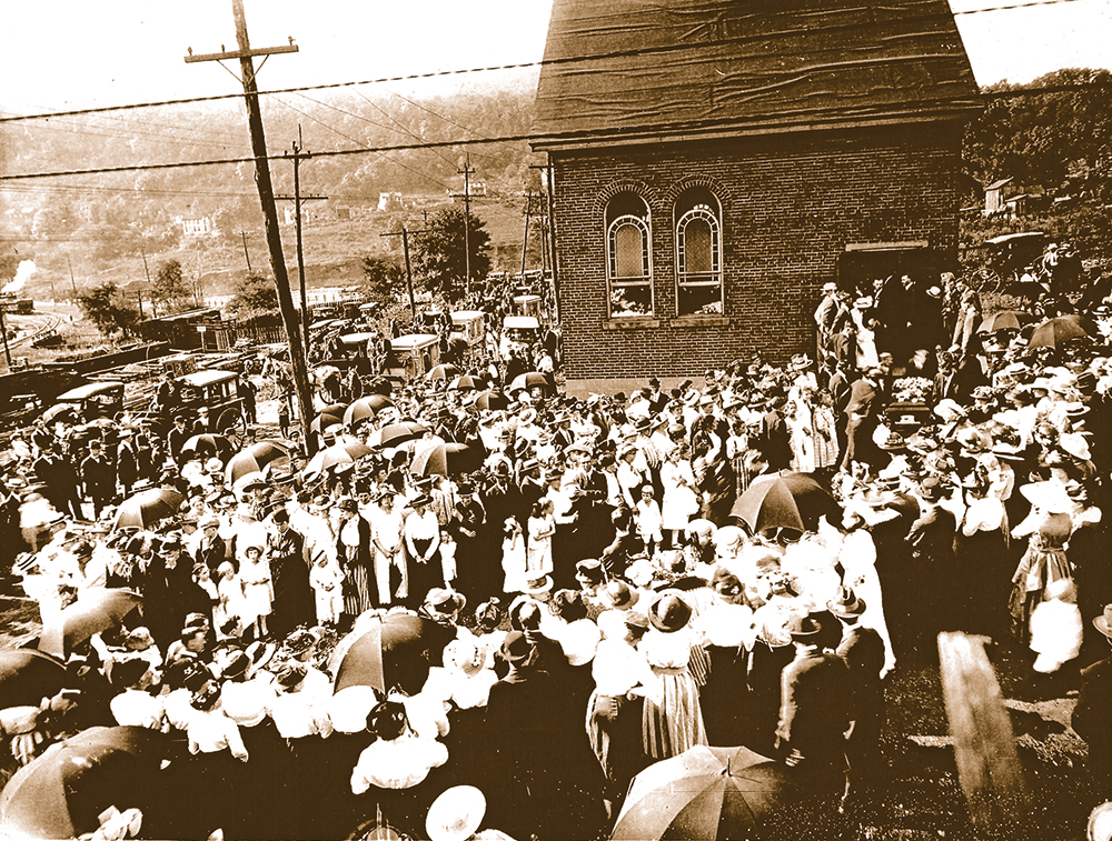 Funeral service at Tanneryville for members of the Dishong family. Horsedrawn hearses are lined up in front of the small church. Harry Dishong Collection