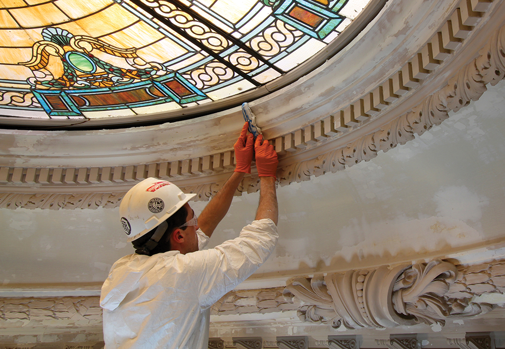 A conservator repairs the damaged plaster surrounding the laylight at Glen Foerd. Glen Foerd on the Delaware