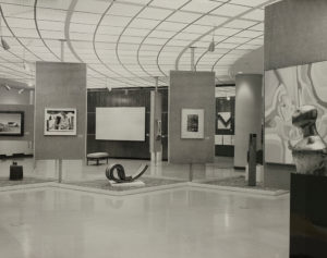 Interior installation of Pennsylvania ’71 featuring the State Museum accession Drift IV, an acrylic-on-canvas painting by Theodore Singer (b. 1929), on the back walnut panel. The State Museum of Pennsylvania