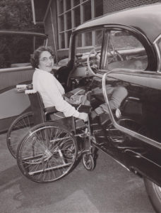 A new kind of mobility awaits Gross as she transfers from a wheelchair to an automobile equipped with hand controls. She was determined to overcome all obstacles to continue her career in newspapering. Annie Halenbake Ross Library, Lock Haven