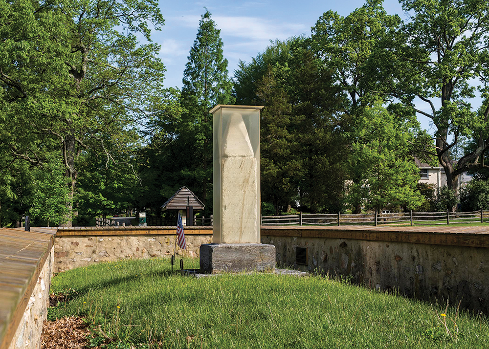 Chipped and scarred by 19th-century vandalism, its inscriptions barely visible due to weathering, the original 1817 marble Paoli monument stands firmly back on its original spot, encased in plexiglas for protection. Photo by Robert Colameco