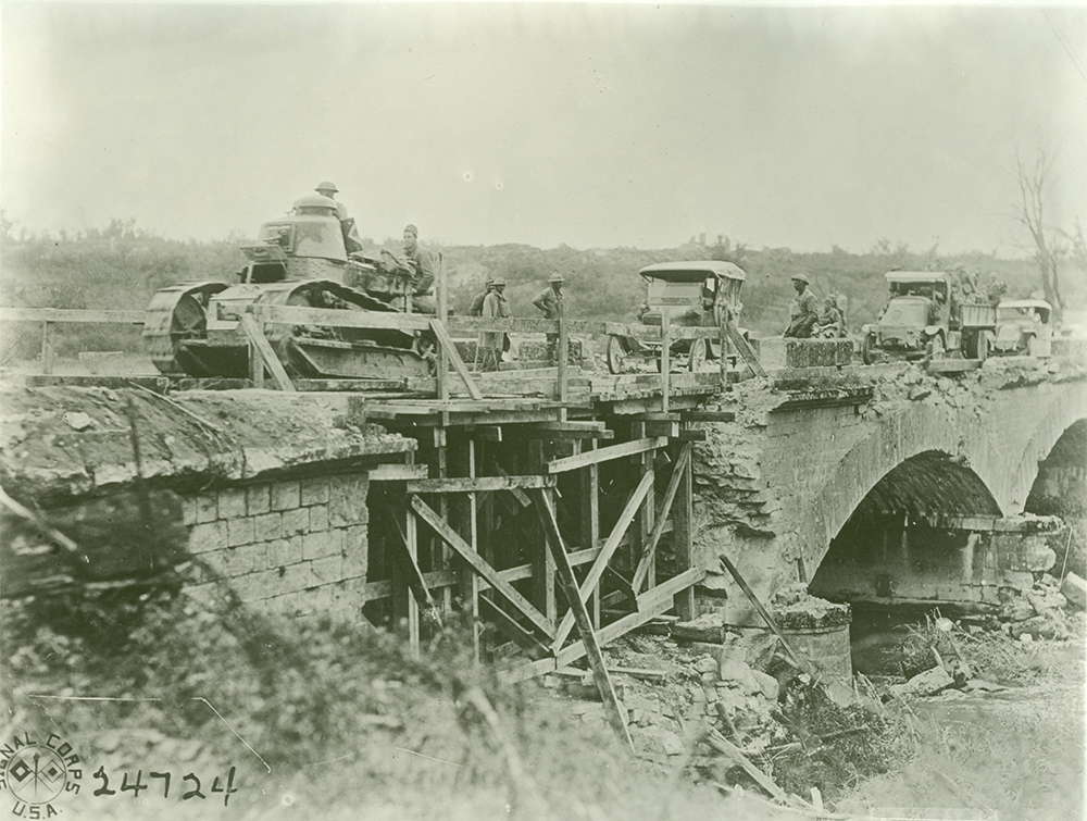 Companies A and E of the 103rd Engineer Regiment, 28th Division, repaired this bridge at Bourevillers, Meuse, allowing the troops to pass on September 28, 1918. Pennsylvania Military Museum/Miller Collection