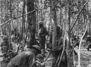 Men of the 28th camping in the woods near Fismes, France, to avoid detection by German reconnaissance aircraft in August 1918. National Archives