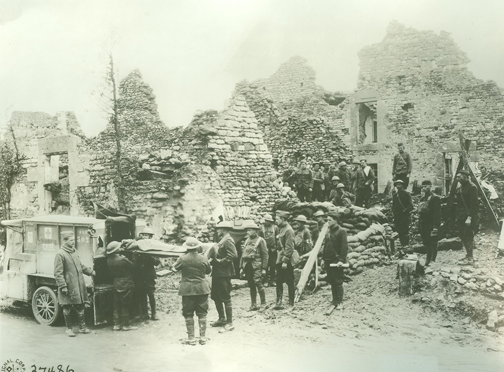 Ambulance companies of the 79th Division transport wounded American soldiers to a first aid station in the basement of a ravaged house in Les Éparges, Meuse, on October 14, 1918. Pennsylvania Military Museum/Miller Collection