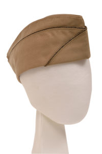 The Narrow Fabric Company made cordedge braids like the black and gold one on this officer’s garrison cap.