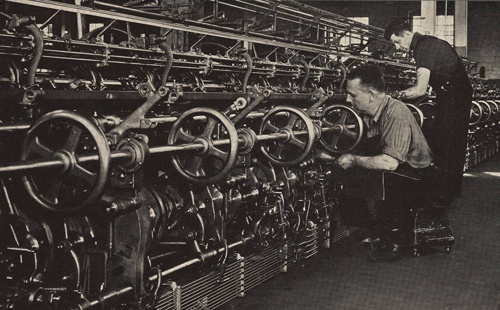 The last vestige of normal business, knitting machine No. 13430 undergoes final adjustments before shipment in October 1942. For the next three years its maker, the Textile Machine Works of Wyomissing, committed its manufacturing capacity to war production. From The Yarn Carrier, June 1942. Permission of the Wyomissing Foundation