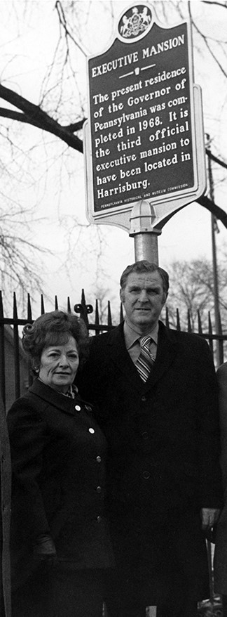 Gov. Raymond P. Shafer and First Lady Jane Shafer, the first residents of the mansion, are seen here on the North Second Street side of the building during a Pennsylvania Historical Marker dedication ceremony on December 10, 1970. Markers were installed adjacent to the mansion at this location and on the North Front Street side. PHMC