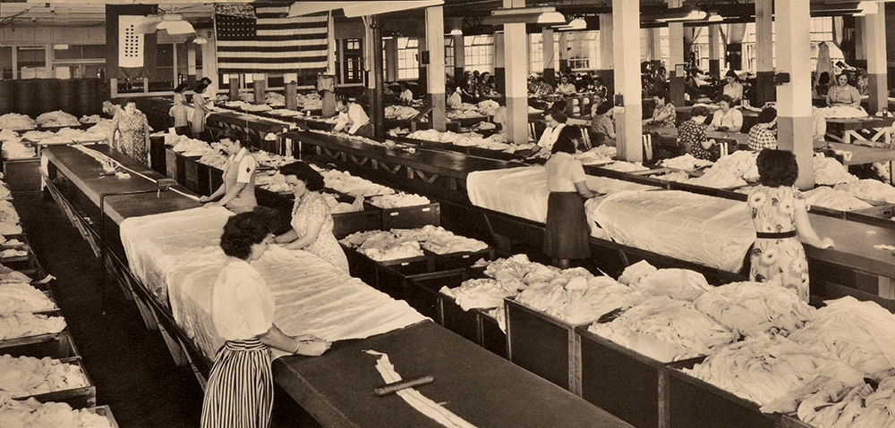 The Rigging Department of Reading Air Chutes where the shroud lines were laid out, cut and attached. The service banner in the background indicates that 25 former employees were serving in the Armed Forces.