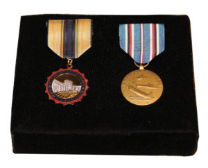 The Women in Military Service for America Memorial Medal, left, and the American Campaign Medal, right, awarded to Louise Baldauski Coleman and donated by her to the Pennsylvania Military Museum.