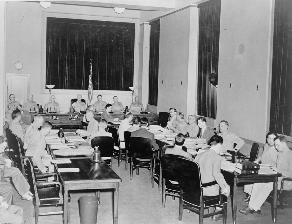 The seven-man commission of generals, at the bench in the back of this photo, presides at the third day of proceedings during the Nazi saboteur trial in the fifth floor courtroom of the Department of Justice building in Washington, D.C., July 1942. Library of Congress