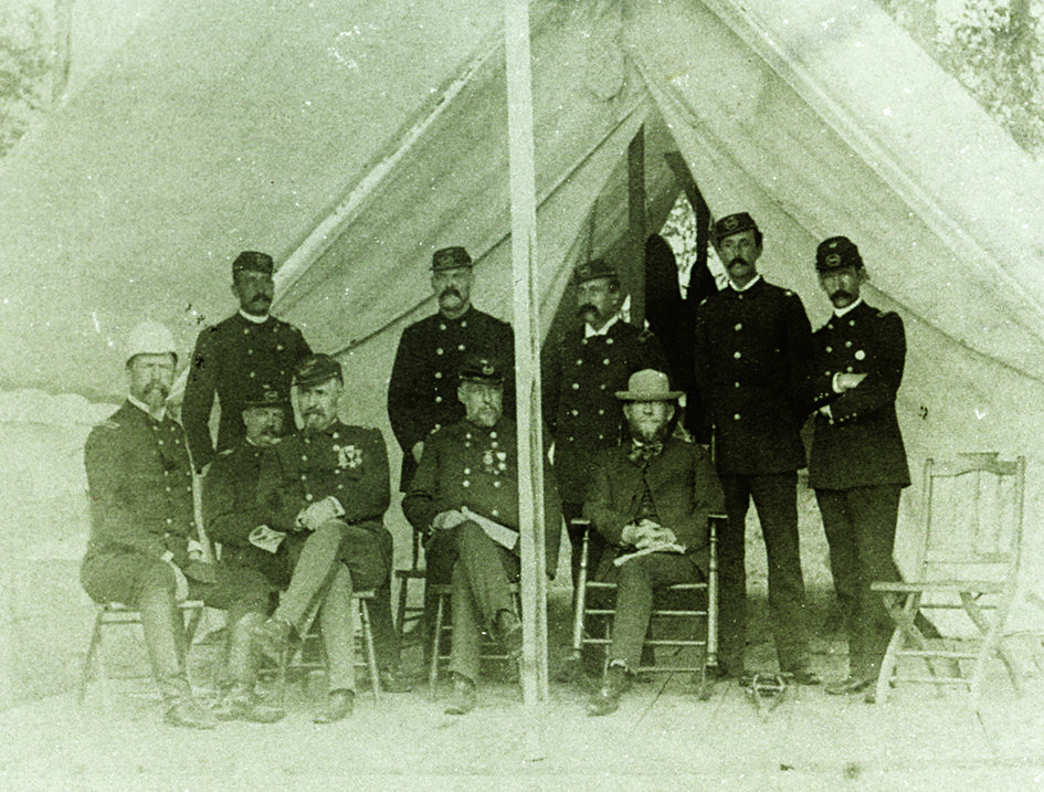 State Adjutant General of Pennsylvania Daniel Hartman Hastings (seated, far left) and Governor James Addams Beaver (seated, far right) attended a National Guard of Pennsylvania encampment at Lake Conemaugh about 1888, shortly before the South Fork Dam burst, releasing the lake’s twenty million tons of water that decimated Johnstown on May 31, 1889. Pennsylvania State Archives / MG-461