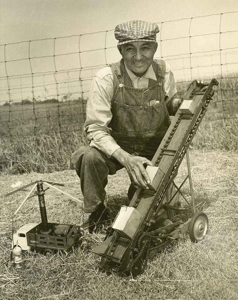 William Chester Ruth with his operating models of the self-raising elevator and a mobile amusement park ride, 1950s. He used a vacuum cleaner motor to power the elevator model. Courtesy Gwendolyn Ruth Dickinson