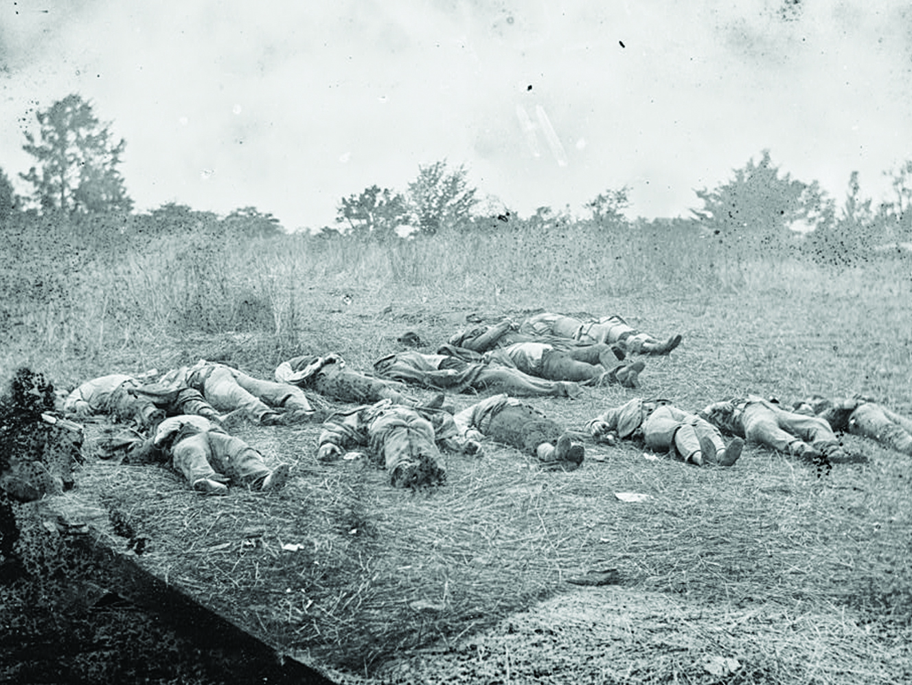 Scenes of fallen soldiers after the Battle of Gettysburg shocked the nation, including Timothy H. O’Sullivan’s stereograph of slain Southern soldiers with a peach orchard owned by John Rose in the distance. Library of Congress