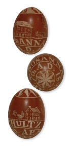 Three views of an 1890 egg depicting a house, a barn and livestock inscribed for Susanna Schultz, a member of the Schwenkfelder community in the Upper Perkiomen Valley. Eggs, Schwenkfelder Library & Heritage Center, Pennsburg, PA / Photo by Patrick J. Donmoyer