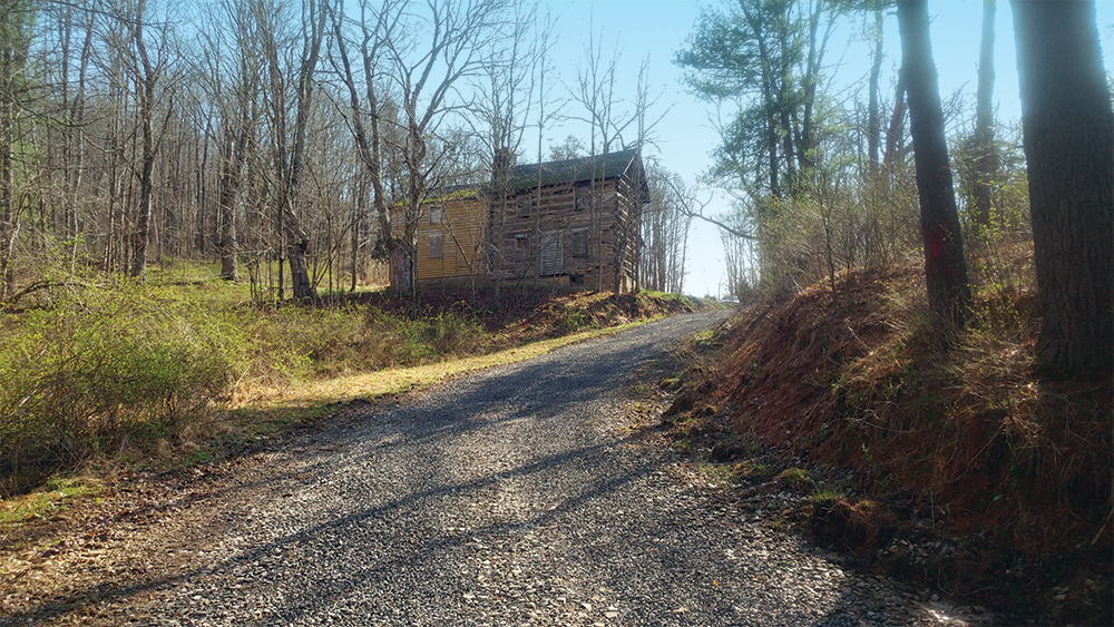 First view of the Carroll Cabin upon rounding a bend in the road. Photo, Katherine Peresolak