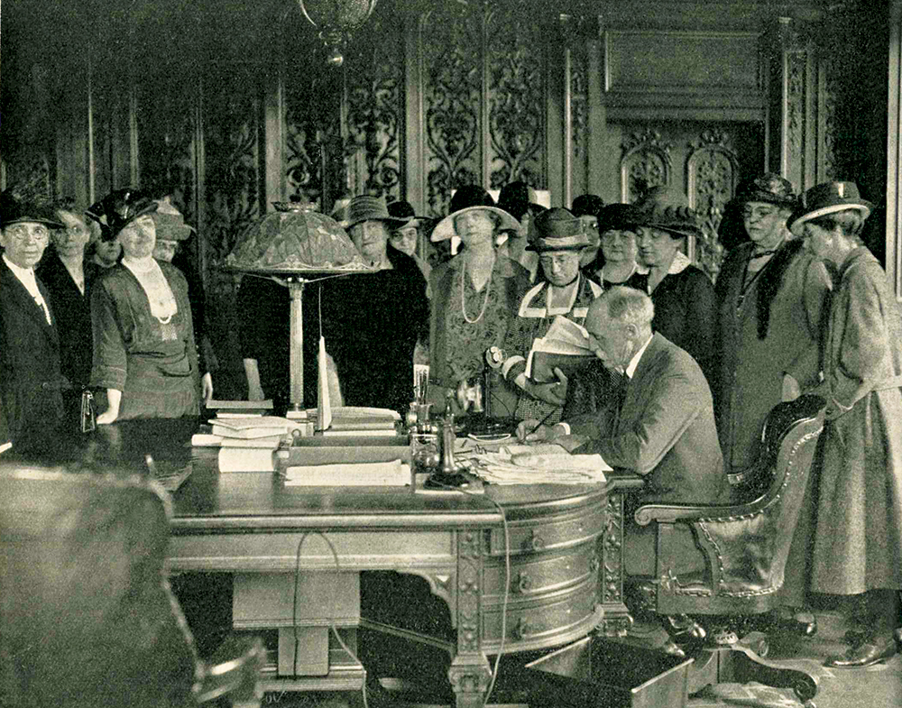 Gifford Pinchot signs the Sheppard-Towner Maternity Act into law as women supporters look on. The bill allowed Pennsylvania to receive matching federal funds in support of women and children’s welfare. From Bulletin of the Pennsylvania League of Women Voters, July 1923