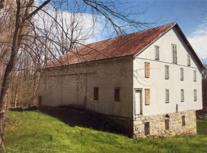 The back of Melester Barn showing the entrance to the upper-level threshing floor from the back. Pennsylvania State Historic Preservation Office