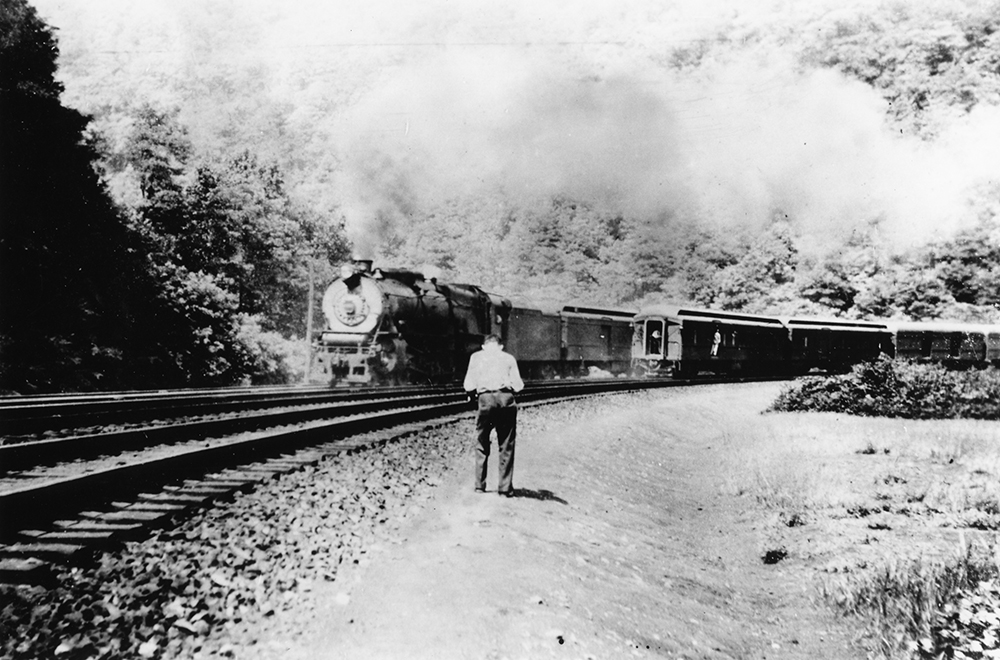 Hart photographing the Pennsylvania Railroad’s Horseshoe Curve in 1937, captured at a farther distance by his friend Edwin Bye Jr. The image shows the Pennsylvania Railroad’s westbound Metropolitan passing the Day Express heading eastbound. George M. Hart Collection, Railroad Museum of Pennsylvania / MG-199 (RR80.49)