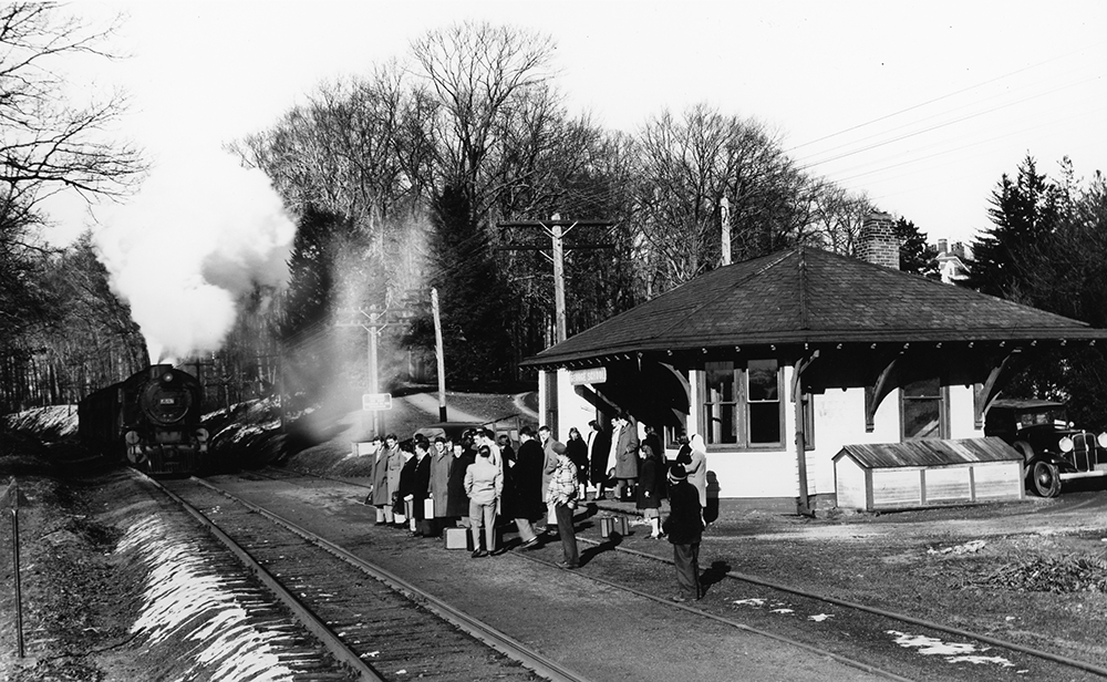 Boarding school students at George School station await the arrival of the 4:10 p.m. train from Newtown, en route to Philadelphia Reading Terminal, in this photo by George Hart. The date of the scene is Friday, March 6, 1948, and students are heading home to visit their families for the weekend. Railroad Museum of Pennsylvania, MG-199 (RR80.49)