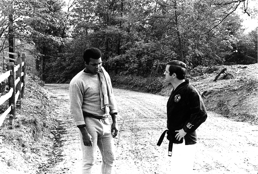 Ali often trained with local martial arts instructor George Dillman. Pictured here in October 1973 along a dirt road on Sculps Hill after a morning run, the two discuss the forthcoming rematch with Joe Frazier scheduled for January 28, 1974. Courtesy George Dillman