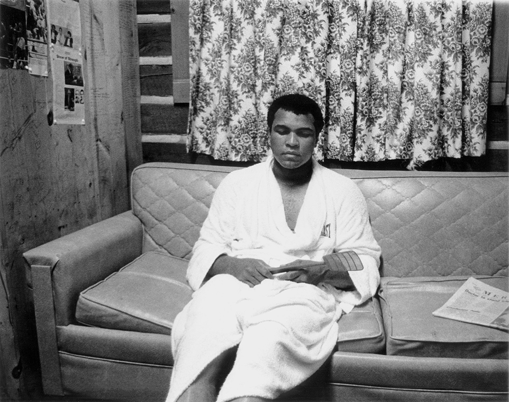 Ali relaxes in the gym’s dressing room after a sparring session in 1978. Photo, ©Jeff Julian