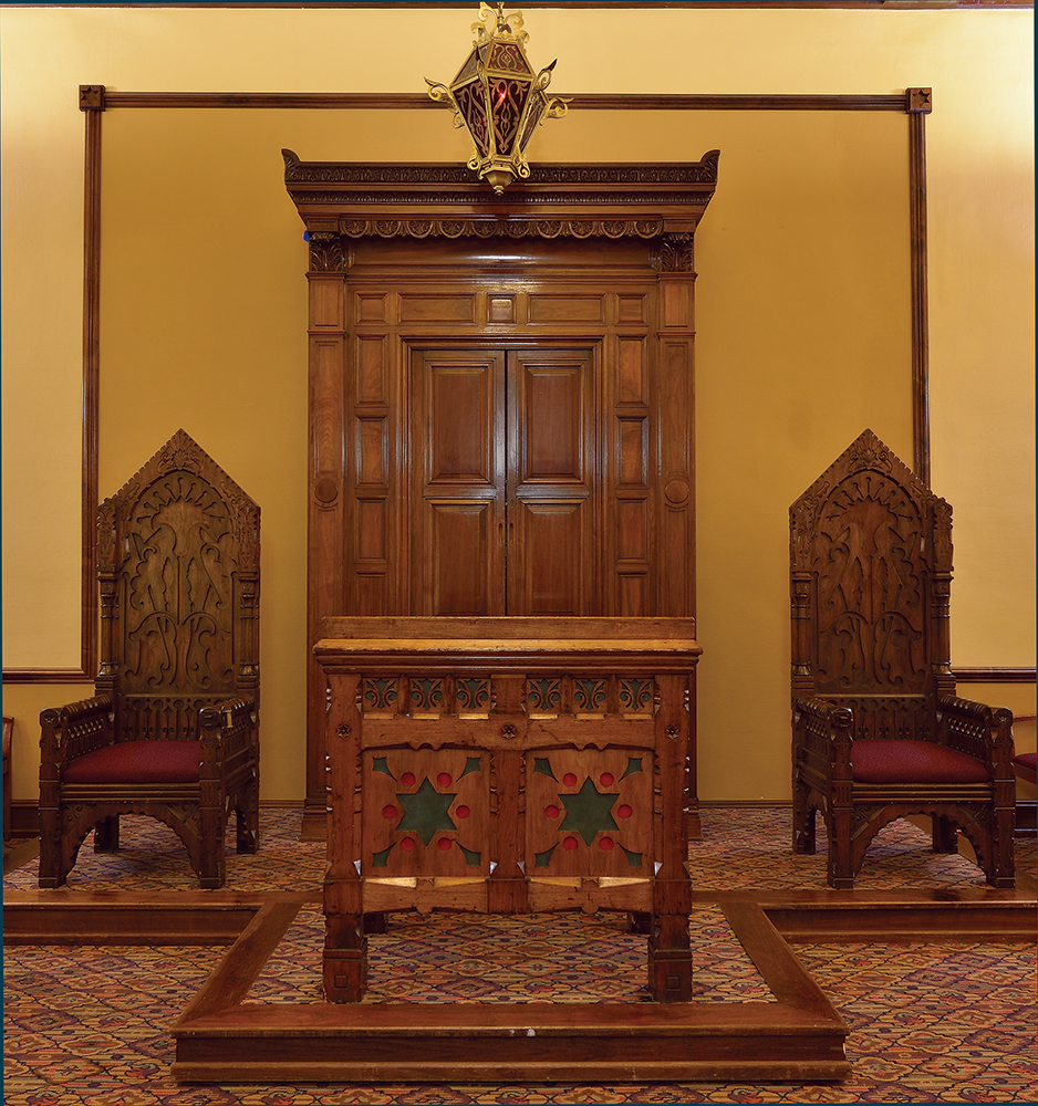 Most of the sanctuary’s Furness-designed furniture — including a brass-plated ner tamid (Eternal Light), high-back chairs, and reader’s desk — grace the chapel of the larger synagogue built by Rodeph Shalom in 1927–28. Furniture, Congregation Rodeph Shalom, Philadelphia / Photo, PHMC