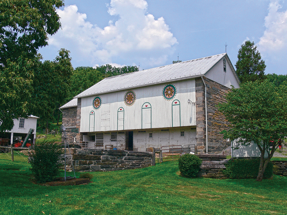 The Sunday Barn in Perry Township, Berks County, bears three classic Hill Stars. They were originally painted sometime in the 1940s, repainted by Johnny Claypoole in the 1980s, and most recently repainted in 2010 by Eric Claypoole. Photo, Patrick J. Donmoyer