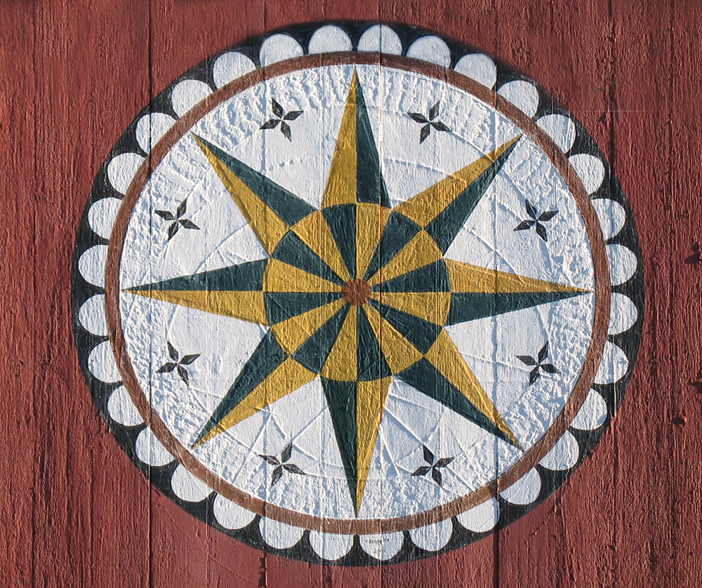 The Sharadin Barn at the Pennsylvania German Cultural Heritage Center at Kutztown University features this classic eight-pointed star. The heavy weathering on the barn siding reveals details of previous iterations of patterns weathered into the surface of the wood under the painted star. Photo, Patrick J. Donmoyer