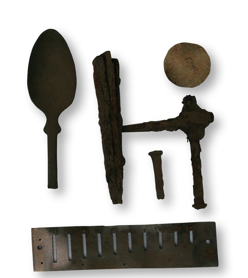 Metal-detected artifacts found at the site of the John and Rosie Allen residence included a spoon, possible handle hardware, button back, a cut nail, and a harmonica reed. Photo, Angela Jaillet-Wentling