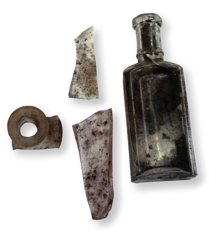 Surface finds from the Pandenarium site included a medicine bottle and fragments of other bottles. Photo, Angela Jaillet-Wentling