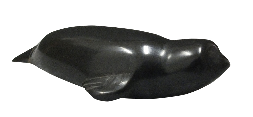 It is unclear whether Paul Allman Siple made these seal and penguin carvings before or after his first Antarctic expedition in 1928–31. Erie Maritime Museum, PHMC (seal, FN2016.10.1; penguin, FN2016.10.2)