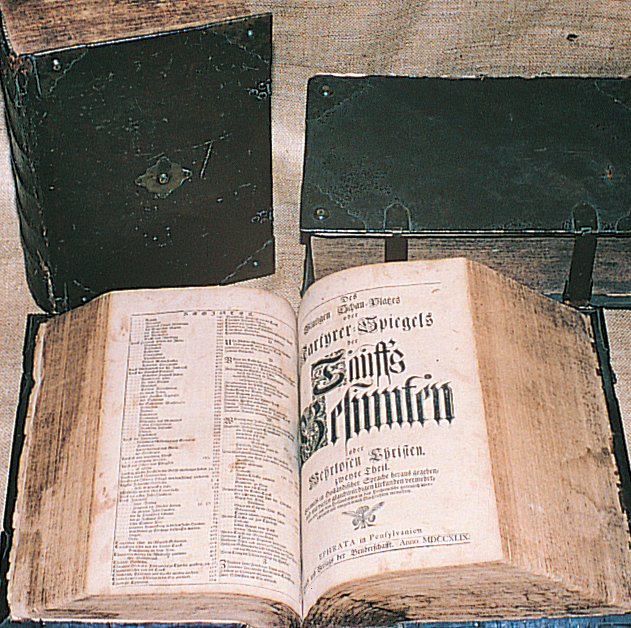 In 1747-49, the Brothers translated the 1,512-page Martyrs Mirror from Dutch into German and published 1,300 copies for the Mennonites. Photos, Ephrata Cloister, PHMC