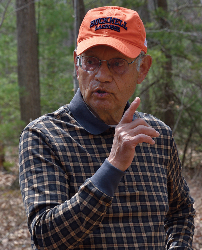 Sid Jamieson discusses Haudenosaunee culture as he explores the metarhyolite quarries. Photo, PHMC