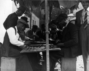 A group of men playing checkers at the corner of 17th and South streets in Philadelphia, September 1938. Pennsylvania State Archives, RG-13