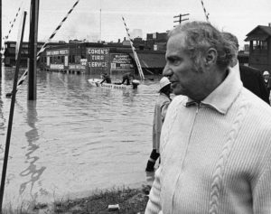 A Coast Guard rescue boat sets off as Pennsylvania governor Milton Shapp inspects the flood waters. Shapp surveyed the devastation in communities throughout the commonwealth and coordinated recovery and relief efforts. Pennsylvania State Archives, MG-309