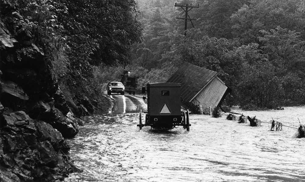 An Amish buggy attempts to cross flood waters on a secondary road in Millheim, Centre County. Pennsylvania State Archives, MG-218