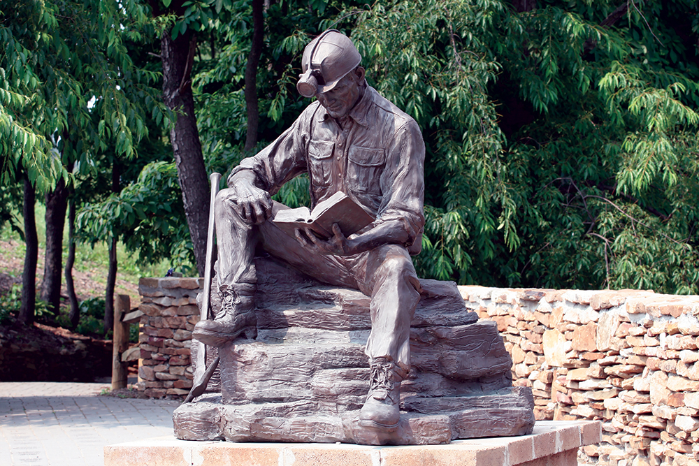 A 7-foot-tall bronze statue of a coal miner at the entrance to the rescue site memorial park. GO Laurel Highlands