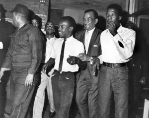 Cecil B. Moore was determined to integrate Girard after he became head of the Philadelphia chapter of the NAACP in 1963. Here he is seen between two young protestors after securing their release from prison; they had been arrested during a demonstration at the school in May 1965. Courtesy of the Special Collections Research Center, Temple University Libraries, Philadelphia, PA