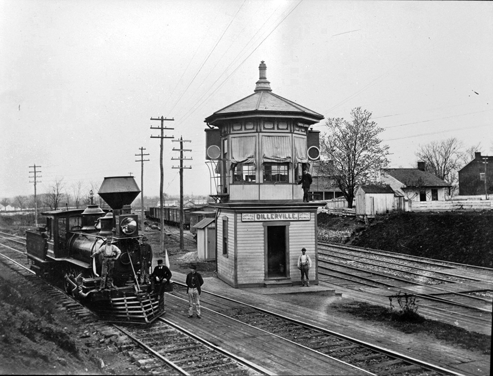 Dillerville Tower, where operators in a classic Pennsylvania Railroad octagonal-topped switch tower kept movement flowing smoothly at the junction of the straight-line Cutoff and the original 1834 main line through downtown Lancaster. The engine appears to be PRR No. 113, a Class H1 2-8-0-type freight locomotive, one of a fleet of 545 such locomotives. Built in 1875, it was scrapped in 1890. Courtesy of LancasterHistory, Lancaster, Pennsylvania