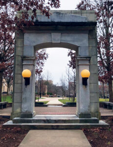 The reassembled Old Main doorway, now called the Old Main Arch Memorial, stands on the West Chester campus near its original location. Photo, West Chester Alumni Association