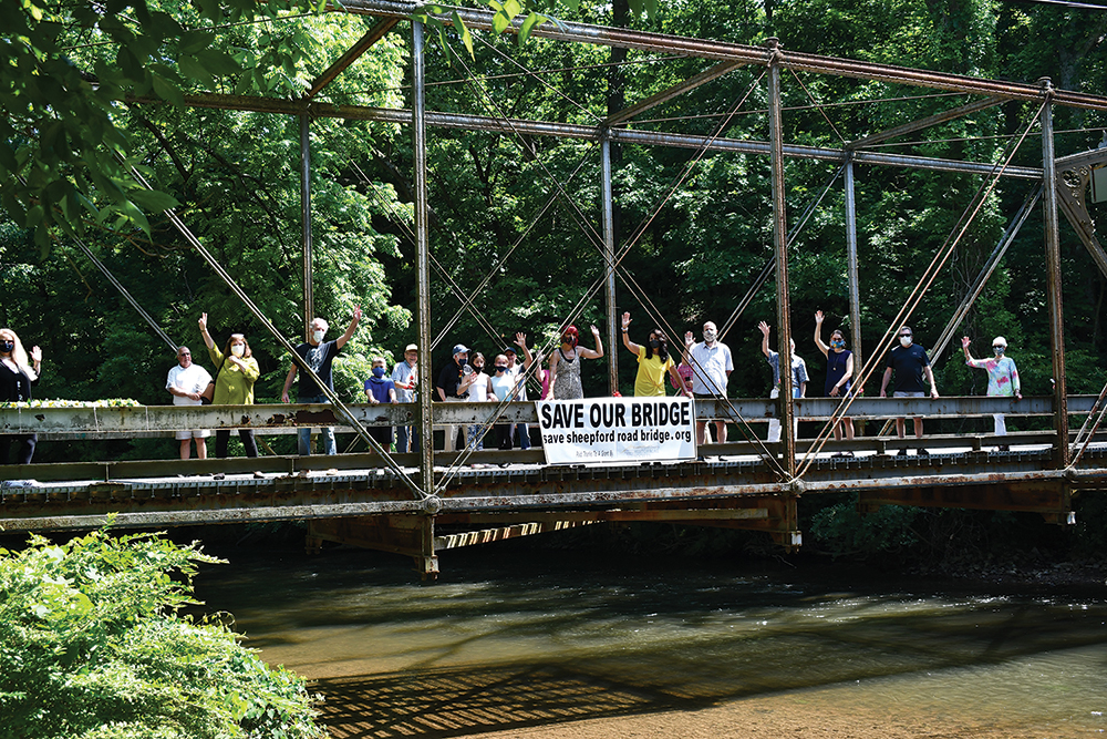 The Friends of the Sheepford Road Bridge unveil their Save Our Bridge banner, June 2020. West Shore Historical Society