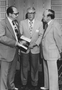 PHMC Executive Director William J. Wewer presents a copy of the June 1976 Commemorative Bicentennial Edition of Pennsylvania Heritage to Fred Long, president of the Blair County Historical Society, and Ernest C. Miller, president emeritus of the Pennsylvania Federation of Historical Societies. Pennsylvania Heritage file photo