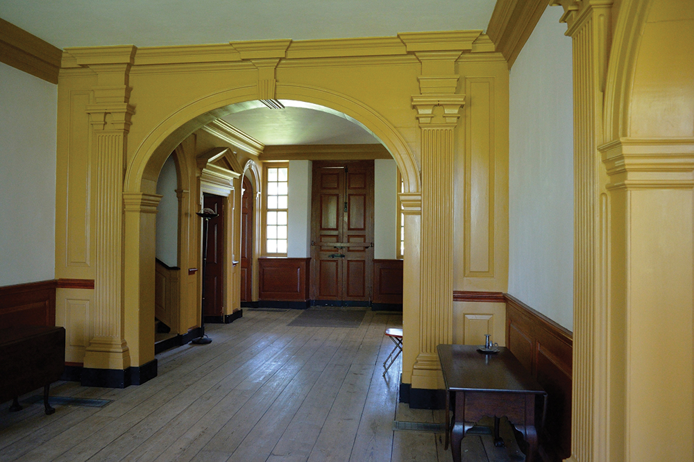 A classic example of Georgian architecture, Hope Lodge’s ground floor (built between 1743 and 1748) has a center hall with rooms symmetrically arranged on either side. This view is from the front door looking toward the rear of the house. Photo, Pennsylvania Historical & Museum Commission